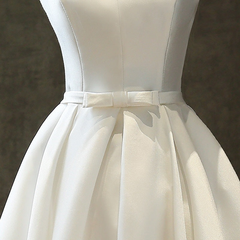 white satin midi dress, waist bow and pleated skirt detail